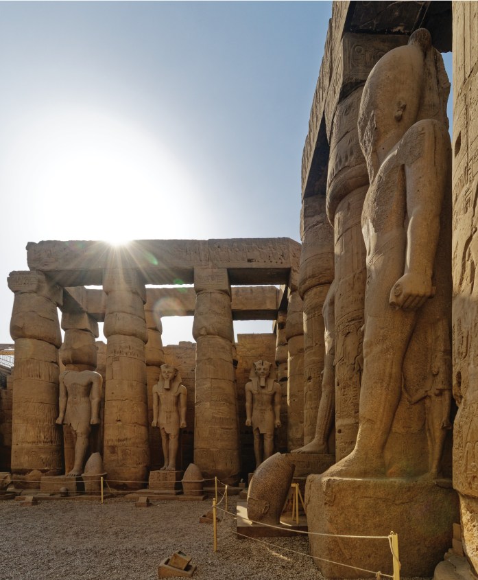 The court built by Rameses II in front of the colonnade, characterised by these standing statues of the king, many of which were reused images of former kings.